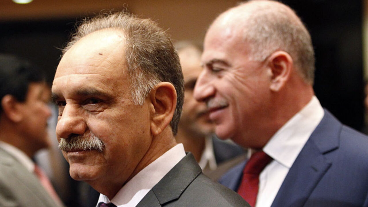 Iraq's Deputy Prime Minister Saleh al-Mutlaq attends a session at the parliament headquarters in Baghdad Iraq's Deputy Prime Minister Saleh al-Mutlaq (L) attends a session at the parliament headquarters in Baghdad July 1, 2014. Newly elected Iraqi lawmakers convene on Tuesday, under pressure to name a unity government to keep the country from splitting apart after an onslaught by Sunni Islamists who have declared a "caliphate" to rule over all the world's Muslims. REUTERS/Thaier Al-Sudani (IRAQ - Tags: POLITICS) - RTR3WMDF