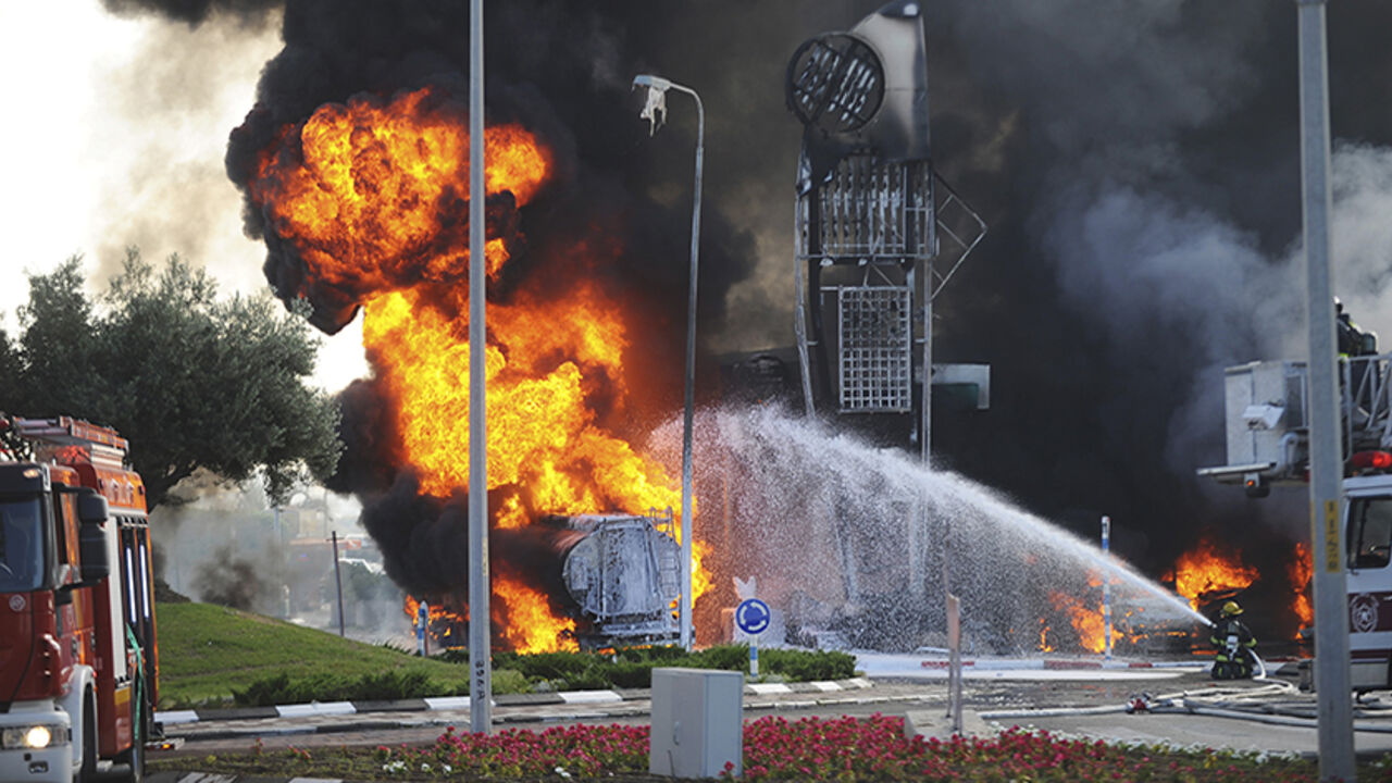 Israeli fire-fighters extinguish a fire that broke out after a rocket hit a petrol station in the southern Israeli city of Ashdod Israeli fire-fighters extinguish a fire that broke out after a rocket hit a petrol station in the southern Israeli city of Ashdod July 11, 2014. Israel pressed on for a fourth day with its Gaza offensive on Friday, striking the Hamas-dominated enclave from air and sea, as Palestinian militants kept up rocket attacks deep into the Jewish state. One rocket on Friday hit the petrol station in Israel's port city of Ashdod, causing a huge blaze and at least three people were seriously wounded, an ambulance spoke