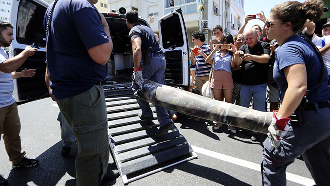 Police explosive experts load the remains of a rocket into a van after it was intercepted by Israel's Iron Dome aerial defense system, in Tel Aviv Police explosive experts load the remains of a rocket into a van after it was intercepted by Israel's Iron Dome aerial defense system, in Tel Aviv July 11, 2014. Israeli air strikes on Gaza killed four more Palestinians before dawn on Friday, raising the death toll from the four day offensive to at least 85, while a Palestinian rocket hit a fuel tanker at an Israeli petrol station causing a huge blaze. REUTERS/Yaron Brener/Ynet (ISRAEL - Tags: POLITICS CIVIL UNREST MILITARY CONFLICT) ISRAEL OUT. NO COMMERCI