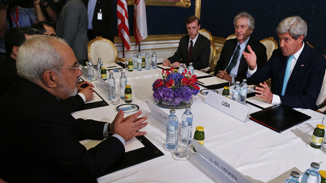 Iran's Foreign Minister Mohammad Javad Zarif meets with U.S. Secretary of State Kerry at talks Iran's nuclear program in Vienna Iran's Foreign Minister Mohammad Javad Zarif (L) meets with U.S. Secretary of State John Kerry (R) at talks between the foreign ministers of the six powers negotiating with Tehran on its nuclear program in Vienna, July 13, 2014. REUTERS/Jim Bourg (AUSTRIA - Tags: POLITICS) - RTR3YE8T