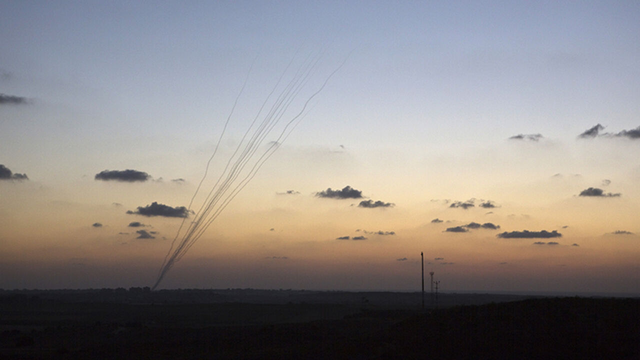 Smoke trails are seen as rockets are launched towards Israel from the northern Gaza Strip Smoke trails are seen as rockets are launched towards Israel from the northern Gaza Strip July 13, 2014. Thousands fled their homes in a Gaza town on Sunday after Israel warned them to leave ahead of threatened attacks on rocket-launching sites, on the sixth day of an offensive that Palestinian officials said has killed at least 160 people. Militants in the Hamas-ruled Gaza Strip kept up rockets salvoes deep into the Jewish state and the worst bout of Israel-Palestinian bloodshed in two years showed no sign