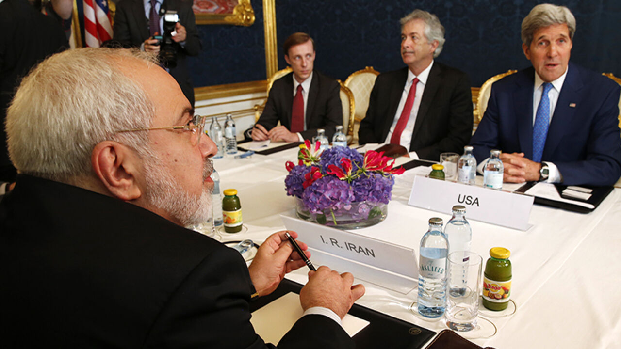 Iran's Foreign Minister Zarif holds a bilateral meeting with U.S. Secretary of State Kerry in Vienna Iran's Foreign Minister Javad Zarif (L) holds a bilateral meeting with U.S. Secretary of State John Kerry (R) on the second straight day of talks over Tehran's nuclear program in Vienna, July 14, 2014. Kerry will press his Iranian counterpart Zarif to make "critical choices" in a second straight day of talks over Tehran's nuclear program on Monday, a U.S. official said. REUTERS/Jim Bourg (AUSTRIA - Tags: POLITICS ENERGY) - RTR3YJOX