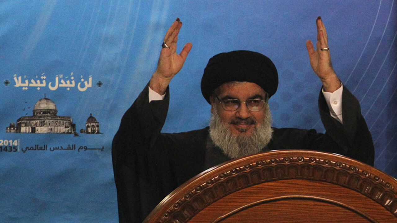 Lebanon's Hezbollah leader Nasrallah gestures during a rally to mark "Quds (Jerusalem) Day" in Beirut's southern suburbs Lebanon's Hezbollah leader Sayyed Hassan Nasrallah gestures as he makes a rare public appearance to addresses his supporters during a rally to mark "Quds (Jerusalem) Day" in Beirut's southern suburbs July 25, 2014. REUTERS/Sharif Karim (LEBANON - Tags: POLITICS CIVIL UNREST ANNIVERSARY) - RTR404VX