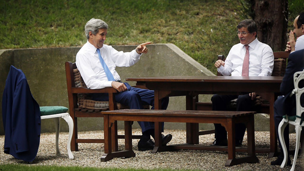 U.S. Secretary of State John Kerry, Qatari Foreign Minister Khaled al-Attiyah and Turkish Foreign Minister Ahmet Davutoglu take part in discussions regarding a cease-fire between Hamas and Israel in Gaza, at the Turkish ambassador's residence in Paris U.S. Secretary of State John Kerry (L), Qatari Foreign Minister Khaled al-Attiyah (R) and Turkish Foreign Minister Ahmet Davutoglu take part in discussions regarding a cease-fire between Hamas and Israel in Gaza, at the Turkish ambassador's residence in Paris July 26, 2014. REUTERS/Charles Dharapak/Pool (FRANCE - Tags: POLITICS CIVIL UNREST) - RTR407S7