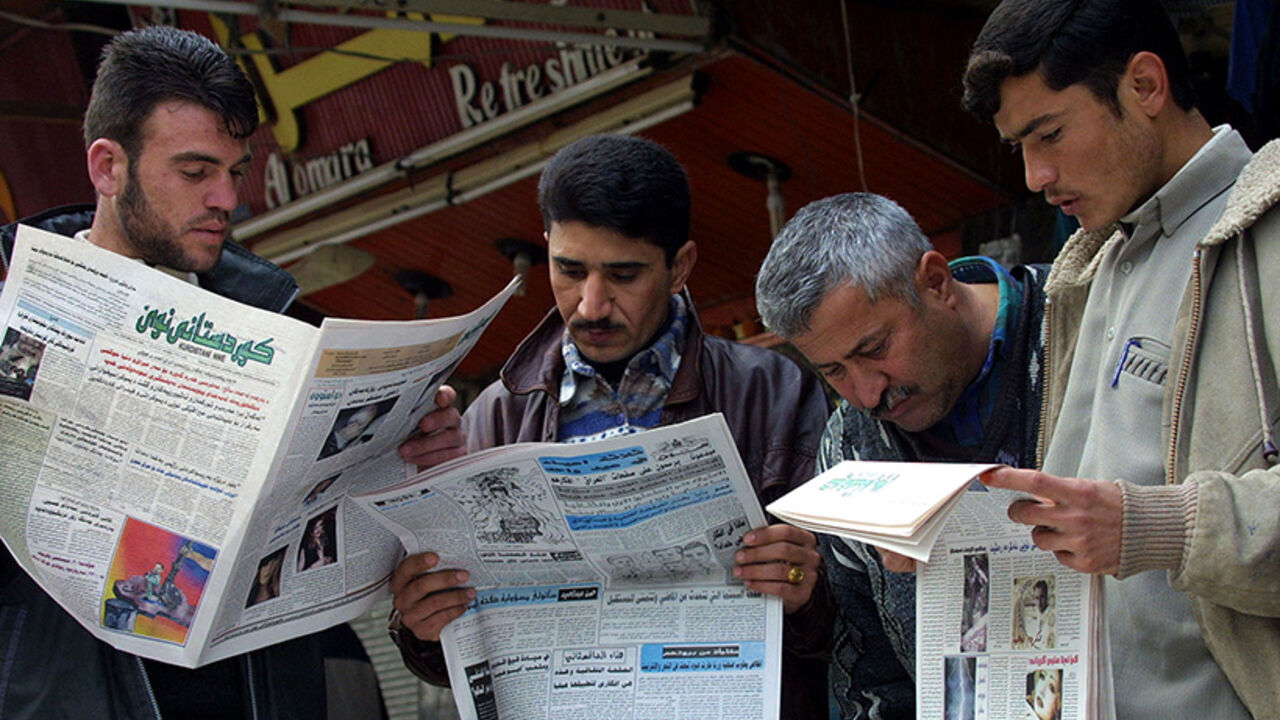 IRAQI KURDS READ NEWSPAPERS IN ARBIL. Iraqi Kurds read newspapers at a newspaper stand in Arbil, northern
Iraq, Febuary 19, 2003. Iraqi Kurds in the breakaway enclave of
northern Iraq said they had arrested Iraqi agents threatening the
safety of opposition leaders gathering to plan for the future of Iraq
if the United States topples Saddam Hussein. REUTERS/Caren Firouz
CJF - RTRIL1S