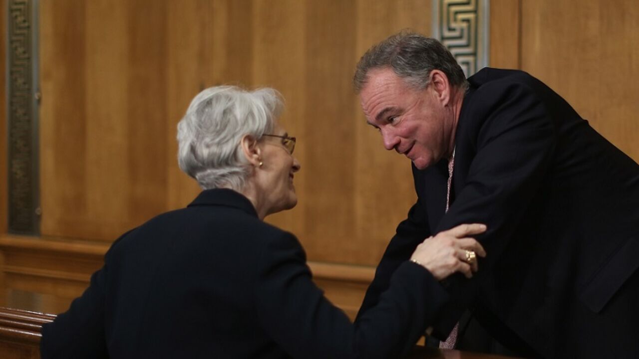 Senate Foreign Relations Committee Holds Hearing On Iran WASHINGTON, DC - JULY 29: State Departent Undersecretary For Political Affairs Wendy Sherman (L) talks with Senate Foreign Relations Committee member Sen. Tim Kaine (D-VA) before she testifies to the committee about the ongoing P-5+1 talks with Iran during a hearing in the Dirksen Senate Office Building on Capitol Hill July 29, 2014 in Washington, DC. Many members of the committee are skeptical that the Obama Administration's agreement to extended talks with Iran for an additional four months will apply en