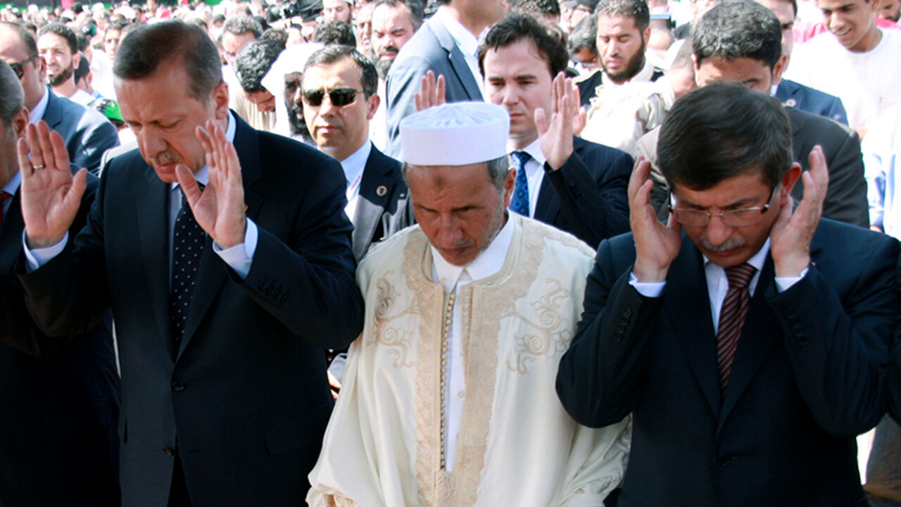 Turkish Prime Minister Recep Tayyip Erdo Turkish Prime Minister Recep Tayyip Erdogan (L) attends Friday prayers with Libya's interim leader Mustafa Abdel Jalil (C) and Turkish Foreign Minister Ahmet Davutoglu (R) in Tripoli's renamed "Martys' Square" on September 16, 2011. Erdogan is on the final leg of his "Arab Spring Tour", which has taken him to Egypt and Tunisia. AFP PHOTO/MAHMOUD TURKIA (Photo credit should read MAHMUD TURKIA/AFP/Getty Images)