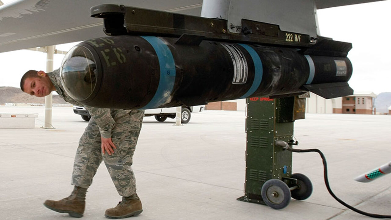 Air Force Works To Meet Increased Demand For Predator Aircraft INDIAN SPRINGS, NV - APRIL 16: Airman 1st Class Ozzy Toma walks around an inert Hellfire missile as he perform a pre-flight check on an MQ-1B Predator unmanned aircraft system (UAS) April 16, 2009 at Creech Air Force Base in Indian Springs, Nevada. The United States Air Force currently has 116 of the aircraft in its UAS fleet with 31 of them airborne at any given moment, flying combat air patrols over Iraq and Afghanistan. After being launched overseas, the Predators are flown by pilots and sensor operator