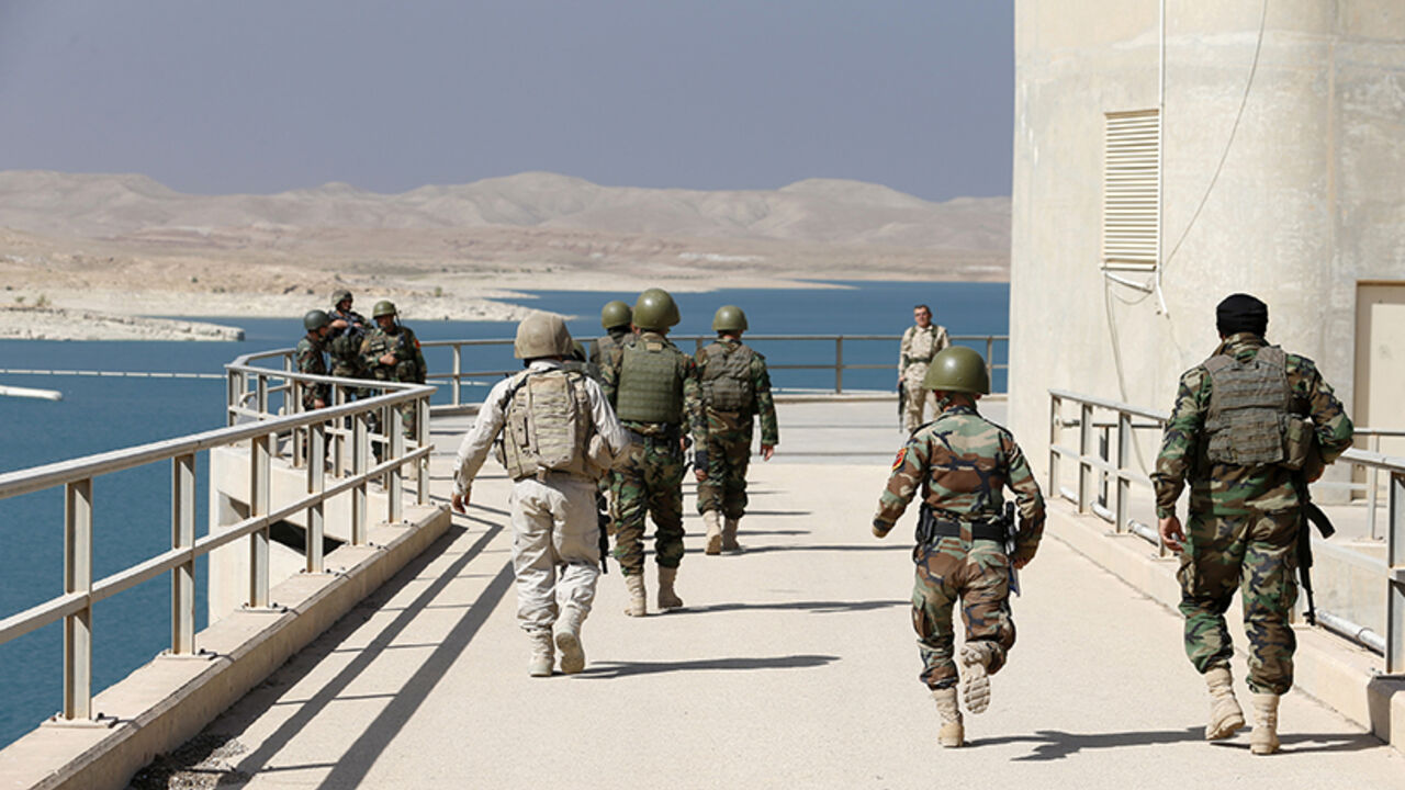 Peshmerga fighters walk on Mosul Dam in northern Iraq Peshmerga fighters walk on Mosul Dam in northern Iraq August 21, 2014. Iraqi and Kurdish forces recaptured Iraq's biggest dam from Islamist militants with the help of U.S. air strikes to secure a vital strategic objective in fighting that threatens to break up the country, Kurdish and U.S. officials said on Monday. REUTERS/Youssef Boudlal (IRAQ - Tags: CIVIL UNREST POLITICS MILITARY) - RTR438VW