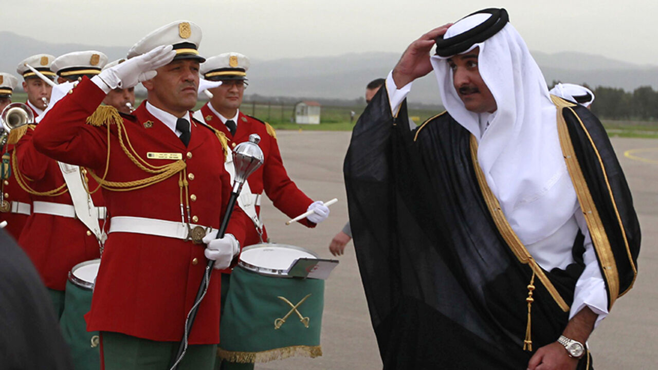 Qatar's Emir Sheikh Hamad al-Thani reviews honour guards during a welcoming ceremony at Algiers airport Qatar's Emir Sheikh Tamim bin Hamad al-Thani reviews honour guards during a welcoming ceremony at Algiers airport April 2, 2014. REUTERS/Louafi Larbi (ALGERIA - Tags: POLITICS) - RTR3JOO5
