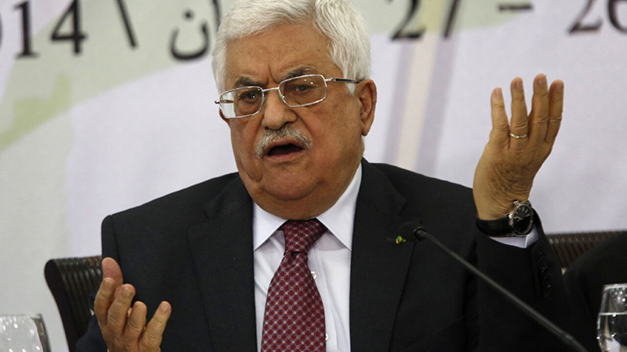 Palestinian President Abbas gestures as he address the Palestinian Liberation Organization's central council in the West Bank City of Ramallah Palestinian President Mahmoud Abbas gestures as he address the Palestinian Liberation Organization's (PLO) central council in the West Bank City of Ramallah April 26, 2014. Abbas said on Saturday he was still ready to extend stalled peace talks with Israel, as long as it met his long-standing demands to free prisoners and halt building on occupied land. REUTERS/Mohamad Torokman (WEST BANK - Tags: POLITICS PROFILE) - RTR3MPL7