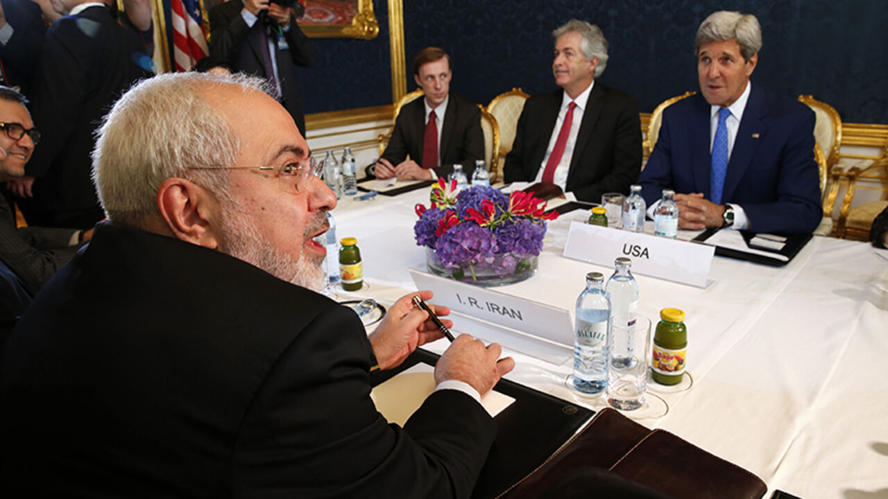 Iran's Foreign Minister Zarif holds a bilateral meeting with U.S. Secretary of State Kerry in Vienna Iran's Foreign Minister Javad Zarif (L) holds a bilateral meeting with U.S. Secretary of State John Kerry (R) on the second straight day of talks over Tehran's nuclear program in Vienna, July 14, 2014. Kerry will press his Iranian counterpart Zarif to make "critical choices" in a second straight day of talks over Tehran's nuclear program on Monday, a U.S. official said. REUTERS/Jim Bourg (AUSTRIA - Tags: POLITICS ENERGY) - RTR3YJOW