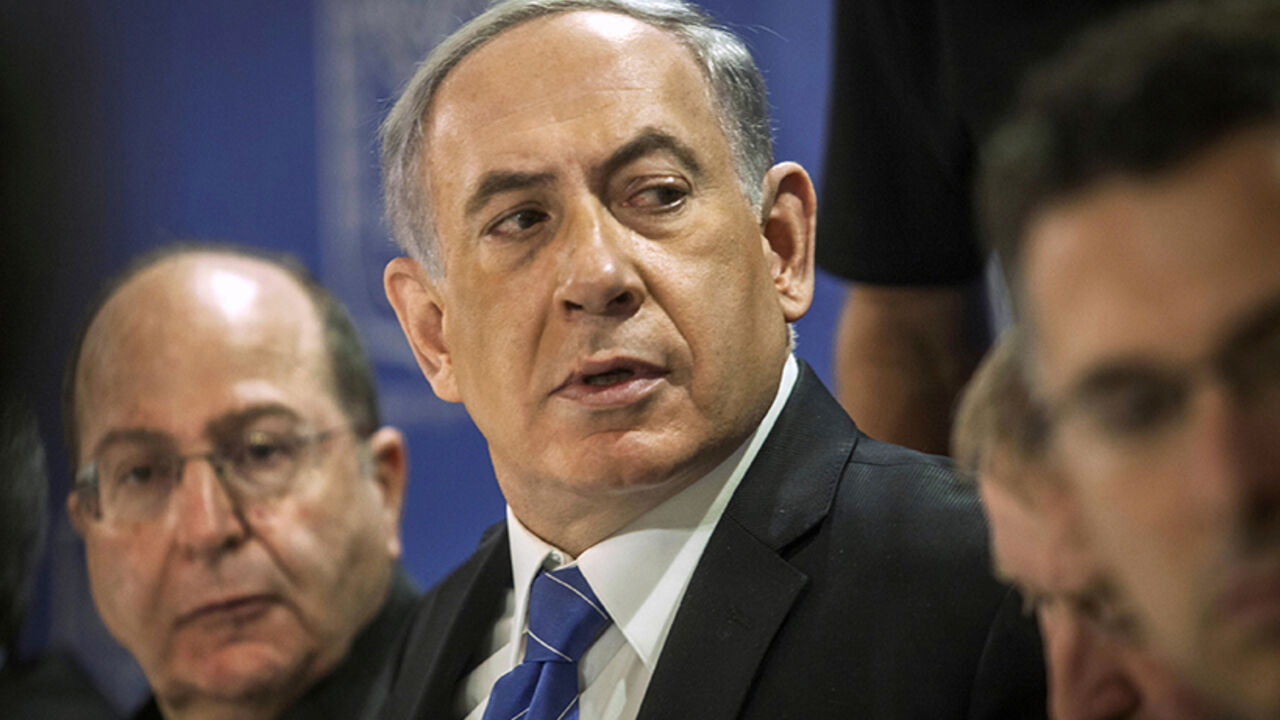 Israel's PM Netanyahu and Defence Minister Yaalon attend a cabinet meeting in Tel Aviv Israel's Prime Minister Benjamin Netanyahu (C) and Defence Minister Moshe Yaalon (L) attend a cabinet meeting in Tel Aviv July 31, 2014. Netanyahu, facing international alarm over a rising civilian death toll in Gaza, said on Thursday he would not accept any ceasefire that stopped Israel completing the destruction of militants' infiltration tunnels. Gaza officials say at least 1,372 Palestinians, most of them civilians, have been killed in the battered territory and nearly 7,000 wounded. Fifty-six Israeli s
