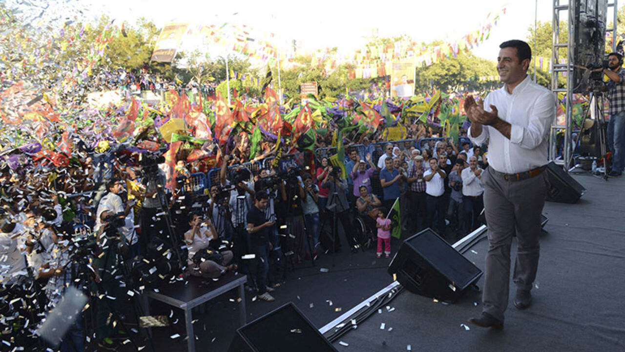 Demirtas, co-chairman of the pro-Kurdish Peoples' Democracy Party and presidential candidate, speaks during an election rally in Diyarbakir Selahattin Demirtas, co-chairman of the pro-Kurdish Peoples' Democracy Party (HDP) and presidential candidate, speaks during an election rally in Diyarbakir, August 8, 2014. Tayyip Erdogan is set to secure his place in history as Turkey's first popularly-elected president on Sunday, but his tightening grip on power has polarised the nation, worried Western allies and raised fears of creeping authoritarianism. Demirtas was running a distant third. REUTERS/Stringer (TURKEY - Tags: POLITICS ELECTIONS) - RTR41Q