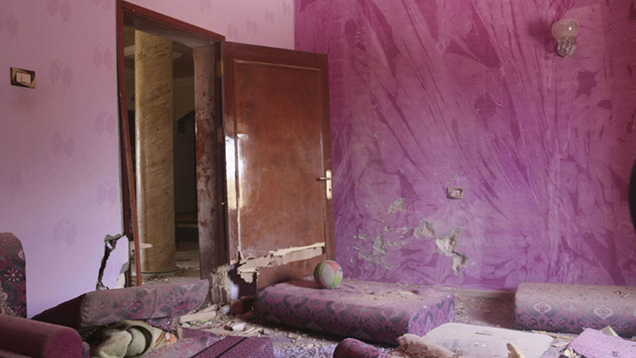 Damage to a house is seen following clashes between rival militias in the Wershavana district of Tripoli Damage to a house is seen following clashes between rival militias in the Wershavana district of Tripoli, August 10, 2014. Heavy shelling resumed in the Libyan capital Tripoli on Sunday after three days of relative calm following more than a month of street fighting between rival armed factions battling for control of the city's airport. REUTERS/Hani Amara (LIBYA - Tags: CIVIL UNREST) - RTR41WJK