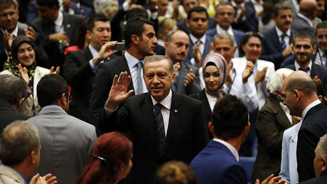 Turkey's Prime Minister Tayyip Erdogan greets members of his ruling AK Party (AKP) as he arrives at a meeting at the party headquarters in Ankara Turkey's Prime Minister Tayyip Erdogan greets members of his ruling AK Party (AKP) as he arrives at a meeting at the party headquarters in Ankara August 14, 2014. Turkish president-elect Erdogan urged his ruling AK Party on Thursday to work for a stronger parliamentary majority next year to enable them to re-write the constitution, signalling no let-up in his drive to create an executive presidency. REUTERS/Umit Bektas (TURKEY - Tags: POLITICS) - RTR42E72