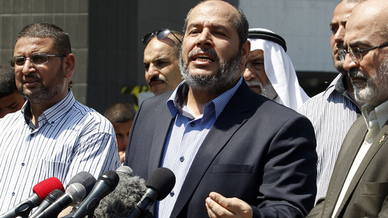 Senior Hamas leader Khalil al-Hayya speaks to the media upon his return to Gaza City from truce talks in Cairo Senior Hamas leader Khalil al-Hayya (C) speaks to the media upon his return to Gaza City from truce talks in Cairo August 14, 2014. A renewed truce between Israel and Hamas appeared to be holding on Thursday despite a shaky start, after both sides agreed to give Egyptian-brokered talks more time to try to end the Gaza war. REUTERS/Ahmed Zakot (GAZA - Tags: POLITICS CIVIL UNREST) - RTR42EMW