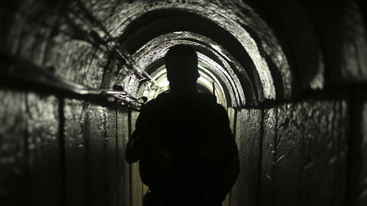 Palestinian fighter from the Izz el-Deen al-Qassam Brigades, the armed wing of the Hamas movement, is seen inside an underground tunnel in Gaza A Palestinian fighter from the Izz el-Deen al-Qassam Brigades, the armed wing of the Hamas movement, is seen inside an underground tunnel in Gaza August 18, 2014. A rare tour that Hamas granted to a Reuters reporter, photographer and cameraman appeared to be an attempt to dispute Israel's claim that it had demolished all of the Islamist group's border infiltration tunnels in the Gaza war. Picture taken August 18, 2014. To match Exclusive MIDEAST-GAZA/TUNNELS REUTERS/Mohammed Salem (GAZA - Tags: