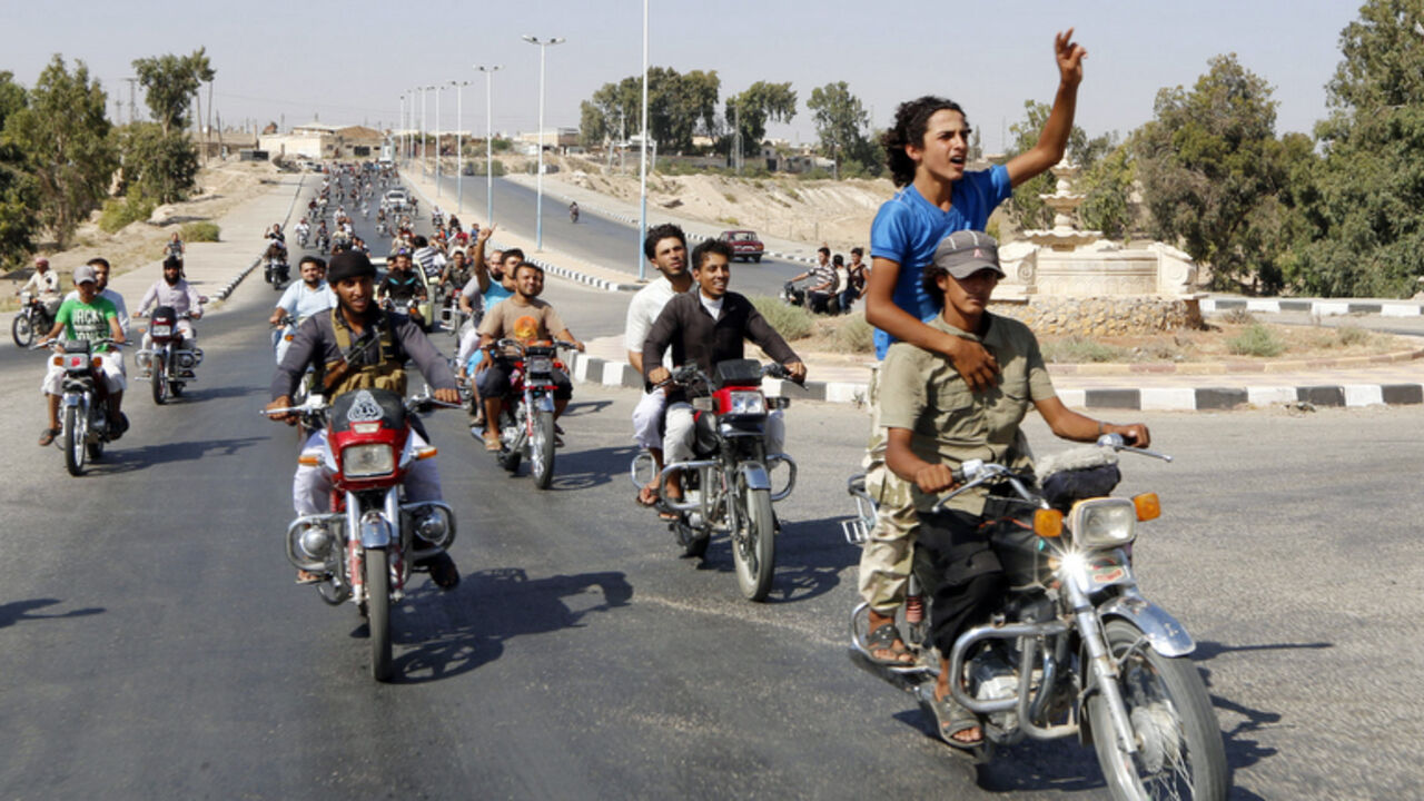 Residents of Tabqa city and Islamic State militants tour the streets in celebration after Islamic State militants took over Tabqa air base in northeast Syria Residents of Tabqa city and Islamic State militants tour the streets in celebration after Islamic State militants took over Tabqa air base in northeast Syria August 24, 2014. Islamic State militants stormed the air base in northeast Syria on Sunday, capturing most of it from government forces after days of fighting over the strategic location, a witness and a monitoring group said. Fighting raged inside the walls of the Tabqa air base, the Syrian army's last foothold in an area otherwise controlled by IS, w
