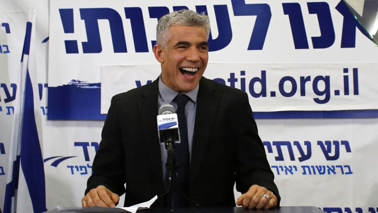 Lapid, leader of the Yesh Atid party, addresses supporters at his party's headquarters in Tel Aviv Yair Lapid, leader of the Yesh Atid (There is a Future) party, addresses supporters at his party's headquarters in Tel Aviv January 23, 2013. The surprise star of Israel's election on Tuesday is Lapid, a former television news anchor whose centrist party, exit polls showed, soared to second place in the balloting only months after he joined politics. REUTERS/Ammar Awad (ISRAEL - Tags: POLITICS ELECTIONS TPX IMAGES OF THE DAY) - RTR3CTCL