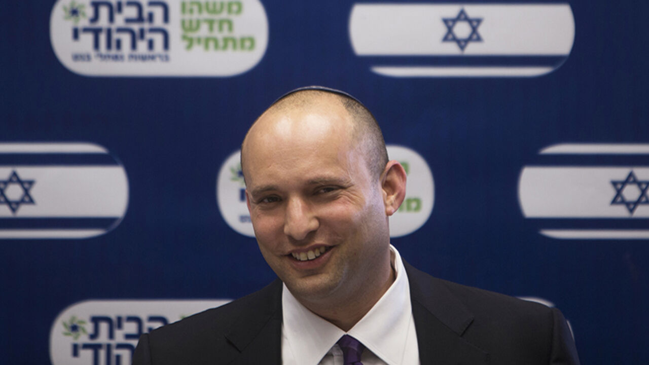 Bennett smiles during a Jewish Home party meeting, at the Knesset, the Israeli parliament, in Jerusalem Naftali Bennett (C), smiles during a Jewish Home party meeting, at the Knesset, the Israeli parliament, in Jerusalem March 4, 2013. A surprise alliance between Israeli political stars, far-right Bennett, and centrist Yair Lapid, who reject privileges for ultra-orthodox Jews is frustrating Prime Minister Benjamin Netanyahu's efforts to form a new government. REUTERS/Ronen Zvulun (JERUSALEM - Tags: POLITICS) - RTR3EKA2