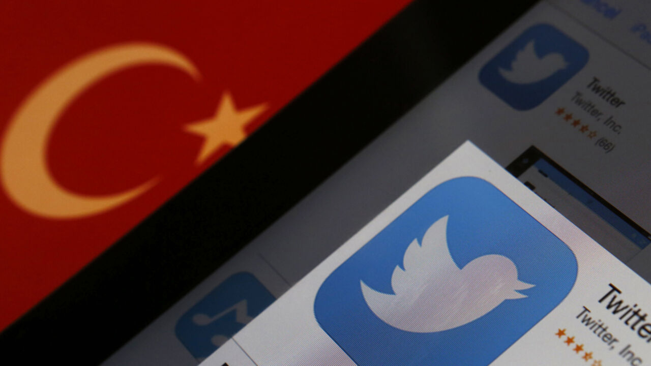 Photo illustration of Twitter logo on an iPad display next to a Turkish flag A Twitter logo on an iPad display is pictured next to a Turkish flag in this photo illustration taken in Istanbul March 21, 2014. Turkey's courts have blocked access to Twitter a little over a week before elections as Prime Minister Tayyip Erdogan battles a corruption scandal that has seen social media awash with alleged evidence of government wrongdoing. The ban came hours after a defiant Erdogan, on the campaign trail ahead of key March 30 local elections, vowed to "wipe out" Twitter and said he did not c