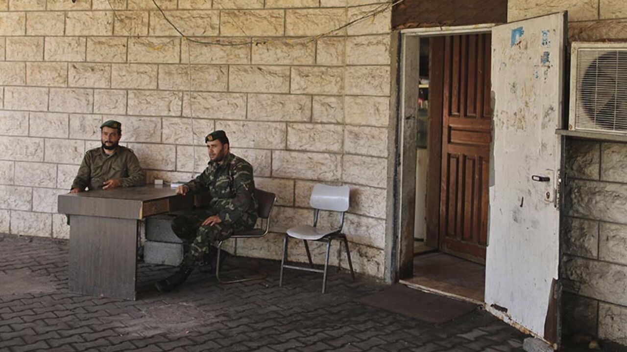 Members of Palestinian security forces loyal to Hamas keep guard at the house of Palestinian president Mahmoud Abbas in Gaza City Members of Palestinian security forces loyal to Hamas keep guard at the house of Palestinian president Mahmoud Abbas in Gaza City May 14, 2014, as they prepare to handover the house which Hamas seized during a brief civil war with Fatah in 2007. Officials from Palestinian President Mahmoud Abbas's Fatah faction and the rival Islamist Hamas group met in Gaza on Tuesday to discuss the make-up of a unity government they hope will end a seven-year schism. REUTERS/Mohammed Salem (GAZA - Tags: POLITICS) - RTR3P45