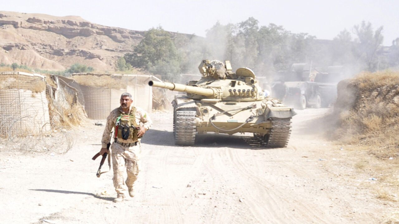 A tank is pictured as Iraqi security forces patrol after clashes with militants of the Islamic State, formerly known as ISIL, in the Hamrin mountains in Diyala province A tank is pictured as Iraqi security forces patrol after clashes with militants of the Islamic State, formerly known as the Islamic State in Iraq and the Levant (ISIL), in the Hamrin mountains in Diyala province July 16, 2014. The Iraqi army and allied Shi'ite militia forces are trying to push back the Sunni insurgents of the al Qaeda offshoot, who swept through northern Iraq last month to within 70 km (45 miles) of Baghdad. Picture taken July 16, 2014. REUTERS/Stringer (IRAQ - Tags: CIVIL UNREST POLITICS C