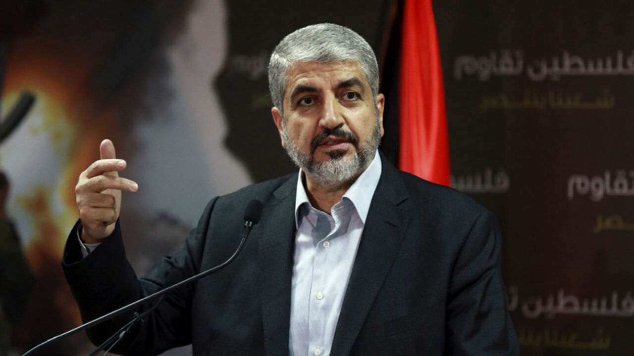 Hamas leader Khaled Meshaal talks during a news conference in Doha July 23, 2014. Meshaal said he was ready to accept a humanitarian truce in Gaza where the Islamist group is fighting an Israeli military offensive, but would not agree to a full ceasefire until the terms had been negotiated. REUTERS/Stringer (QATAR - Tags: POLITICS CIVIL UNREST CONFLICT) - RTR3ZVSR