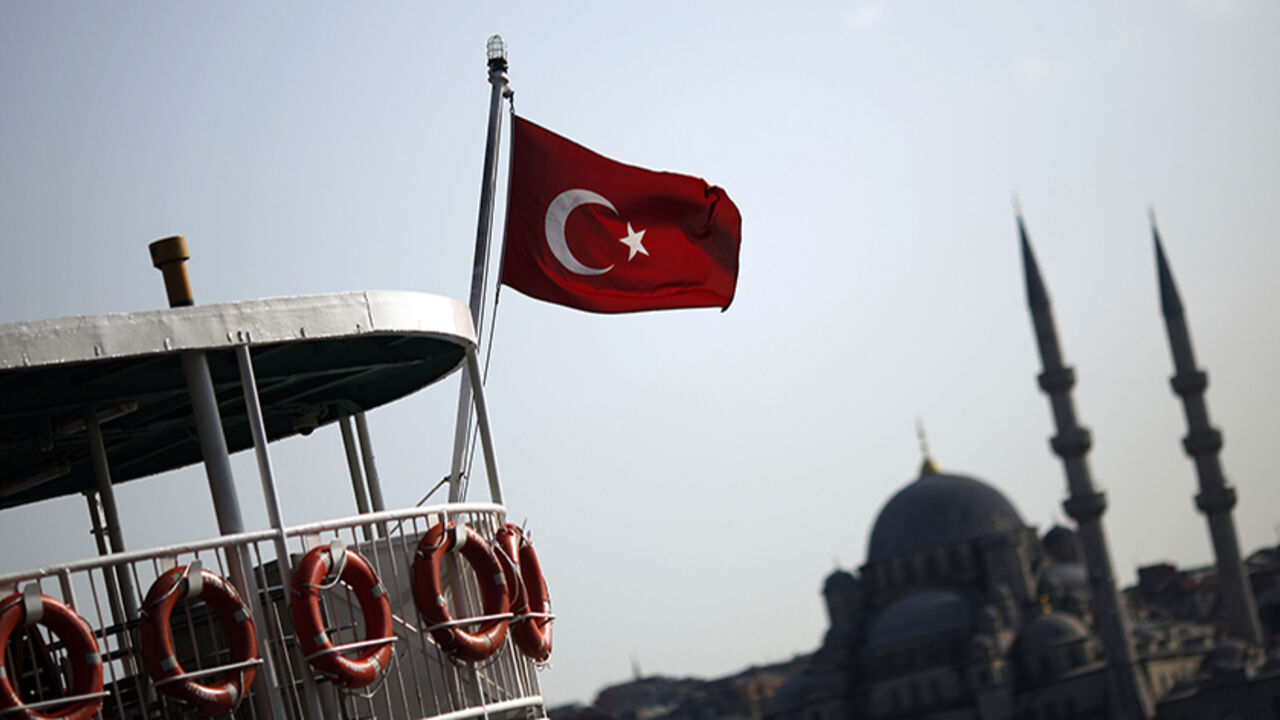 A Turkish flag, with the Ottoman-era New mosque in the background, flies over a passenger ferry in Istanbul A Turkish flag, with the Ottoman-era New mosque in the background, flies over a passenger ferry in Istanbul August 20, 2014. REUTERS/Murad Sezer (TURKEY - Tags: RELIGION TRAVEL) - RTR434PO