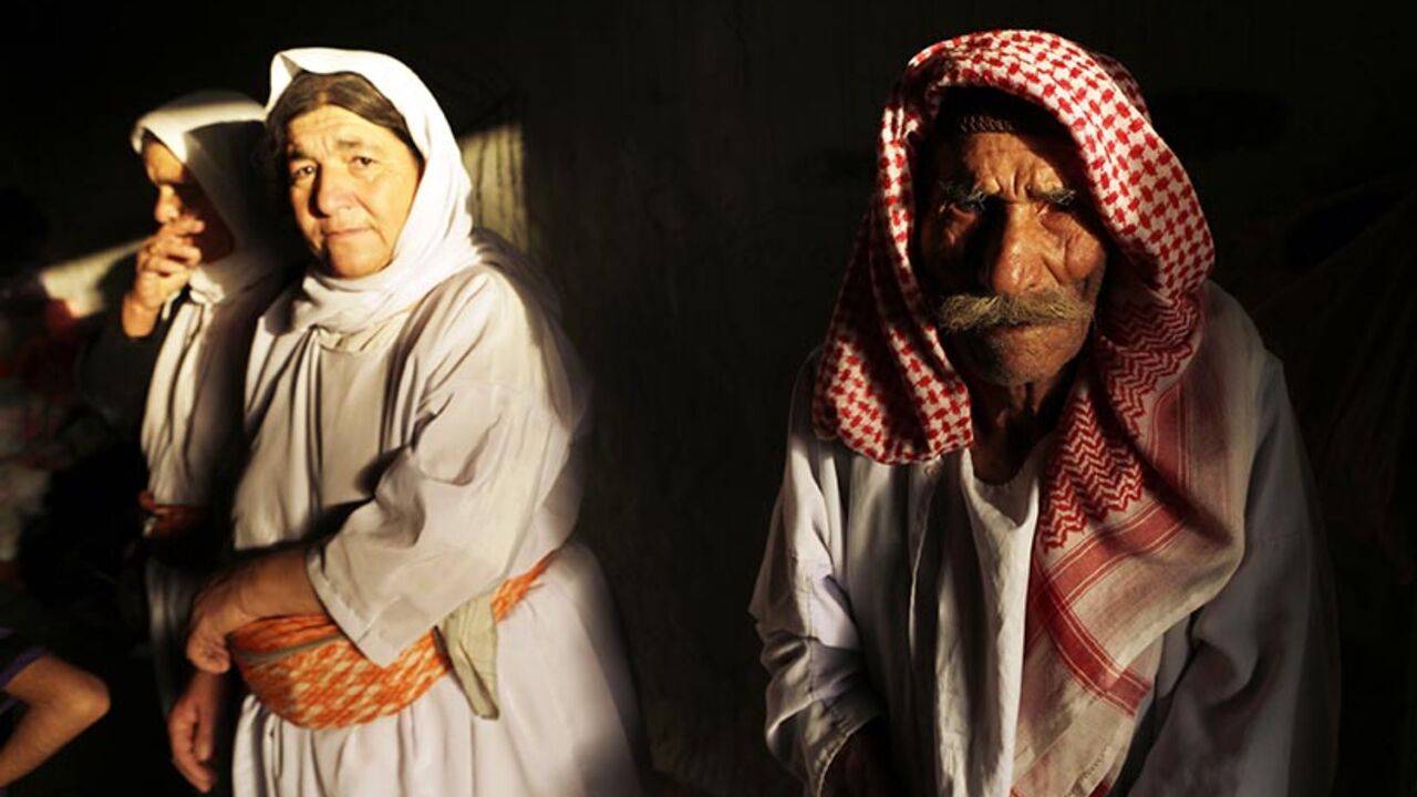 Displaced people from the minority Yazidi sect who fled the violence in the Iraqi town of Sinjar, wait for aid at an abandoned building that they are using as their main residence, outside the city of Dohuk Displaced people from the minority Yazidi sect who fled the violence in the Iraqi town of Sinjar, wait for aid at an abandoned building that they are using as their main residence, outside the city of Dohuk August 25, 2014. REUTERS/Youssef Boudlal (IRAQ - Tags: CIVIL UNREST POLITICS) - RTR43PC3