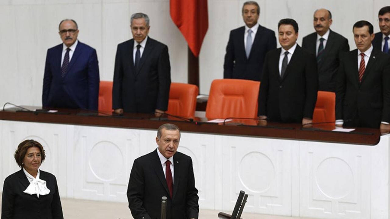 Turkey's new President Tayyip Erdogan attends a swearing in ceremony at the parliament in Ankara Turkey's new President Tayyip Erdogan (front C) attends a swearing in ceremony at the parliament in Ankara August 28, 2014. Erdogan was sworn in as Turkey's 12th president at a ceremony in parliament on Thursday, cementing his position as the country's most powerful modern leader, in what his opponents fear will herald an increasingly authoritarian rule. REUTERS/Umit Bektas (TURKEY - Tags: POLITICS TPX IMAGES OF THE DAY) - RTR4437V