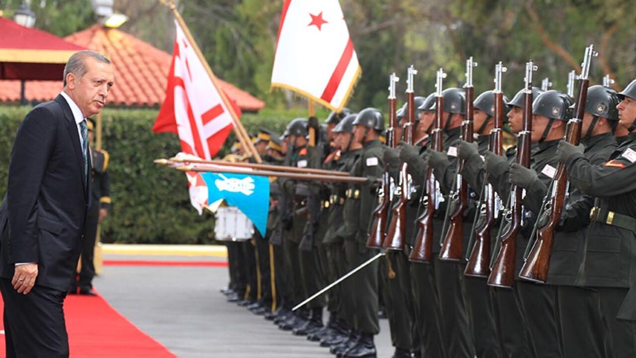 Turkey's President Tayyip Erdogan inspects the honour guard during a visit to Northern Cyprus Turkey's President Tayyip Erdogan inspects the honour guard during a visit to Northern Cyprus September 1, 2014. Erdogan paid his first visit abroad as head of state to Northern Cyprus on Monday and said the window of opportunity will not remain open forever for a "two state solution" in the country. REUTERS/Andreas Manolis (CYPRUS - Tags: POLITICS) - RTR44JWG
