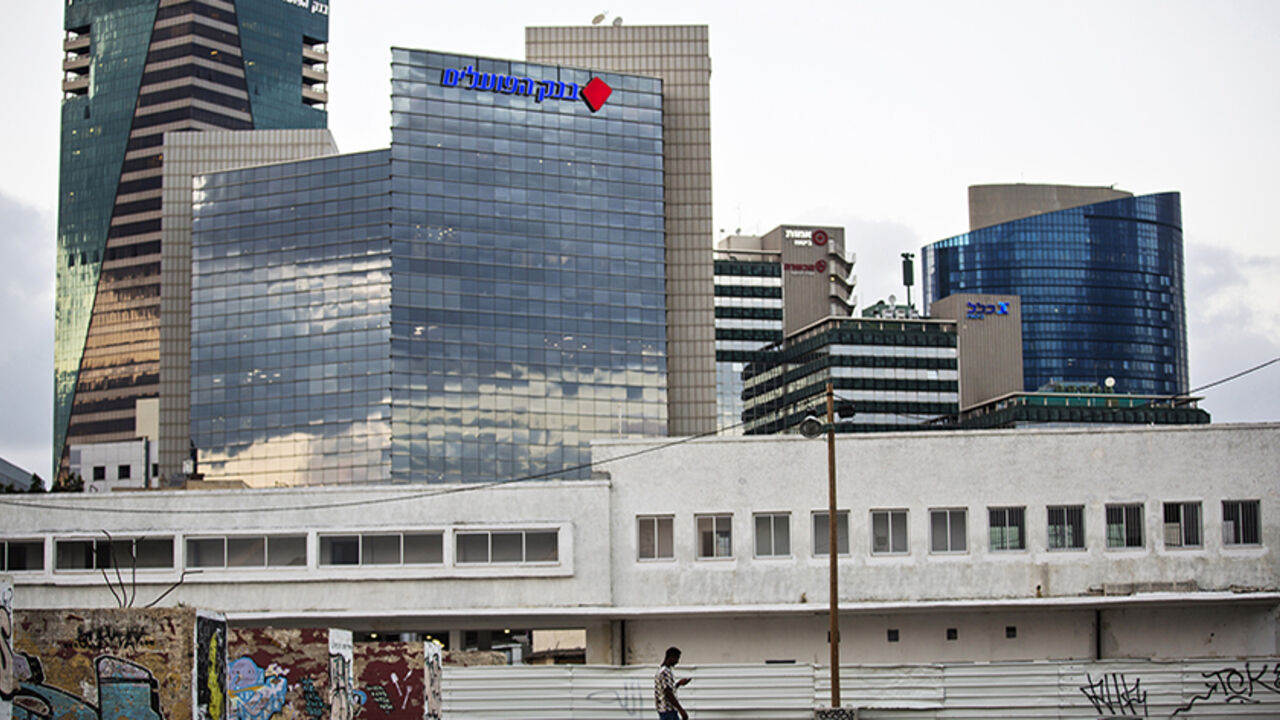 African migrant walks on the pavement as buildings are seen in the background, in south Tel Aviv An African migrant walks on the pavement as buildings are seen in the background, in south Tel Aviv July 17, 2013. Israel's supreme court on Monday struck down a year-old law that meant African migrants could be held in detention for up to three years without charge. Picture taken July 17, 2013. REUTERS/Amir Cohen (ISRAEL - Tags: POLITICS SOCIETY IMMIGRATION) - RTX13NKU