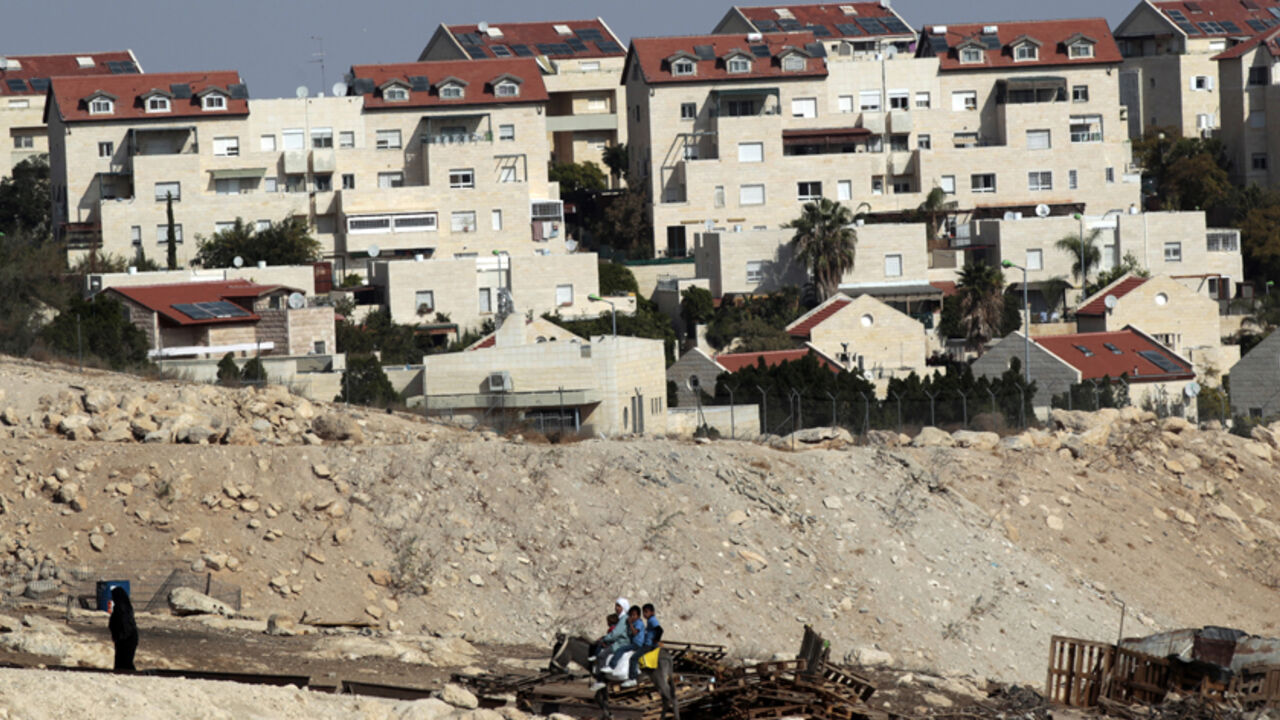 Palestinians ride on a donkey near homes in the West Bank Jewish settlement of Maale Adumim, near Jerusalem Palestinians ride on a donkey near homes in the West Bank Jewish settlement of Maale Adumim, near Jerusalem November 13, 2013. Palestinian President Mahmoud Abbas said on Wednesday his peace negotiators had resigned over the lack of progress in U.S.-brokered statehood talks clouded by Israeli settlement building. REUTERS/Ammar Awad (WEST BANK - Tags: POLITICS SOCIETY ANIMALS) - RTX15BNX