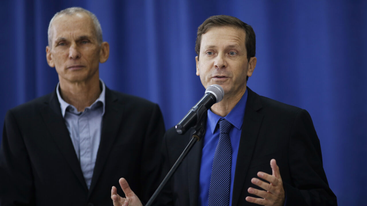 Herzog, head of Israel's Labour Party, speaks during a news conference after his meeting with Palestinian President Abbas in Ramallah Isaac Herzog (R), the newly elected head of Israel's left-of-centre Labour Party, speaks during a news conference after his meeting with Palestinian President Mahmoud Abbas in the West Bank city of Ramallah December 1, 2013. REUTERS/Mohamad Torokman (WEST BANK - Tags: POLITICS) - RTX15ZO7