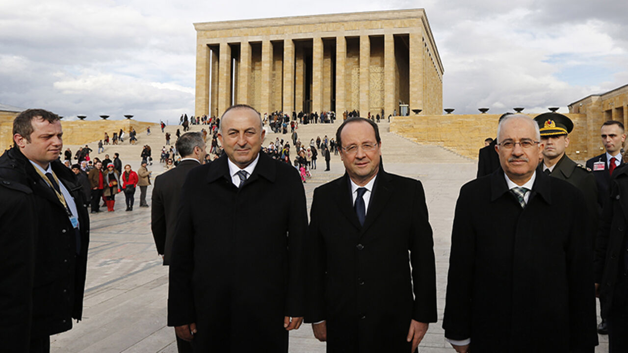 France's President Hollande leaves following a wreath-laying ceremony at Anitkabir, the mausoleum of modern Turkey's founder Mustafa Kemal Ataturk, in Ankara France's President Francois Hollande (2nd R), accompanied by Turkey's Minister for EU Affairs and Chief Negotiator Mevlut Cavusoglu (2nd L), leaves following a wreath-laying ceremony at Anitkabir, the mausoleum of modern Turkey's founder Mustafa Kemal Ataturk, in Ankara January 27, 2014. Hollande is in Turkey for a two-day official visit. REUTERS/Murad Sezer (TURKEY - Tags: POLITICS) - RTX17WV2