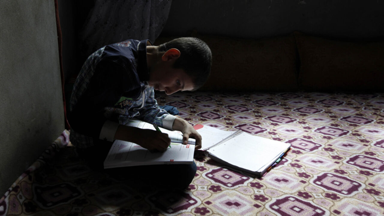 Ferhat Savun workes on his homework in his home in town of Cizre in Sirnak province Ferhat Savun aged 11, works on his homework in his home in town of Cizre in Sirnak province, near the border with Syria March 23, 2013. Turkey's fledgling peace process with the Kurdistan Workers Party (PKK) militant group is all over the headlines. After three decades of war, 40,000 deaths and a devastating impact on the local economy, everybody seems ready for peace. Pro-Kurdish politicians are focused on boosting minority rights and stronger local government for the Kurds, who make up about 20 percent o