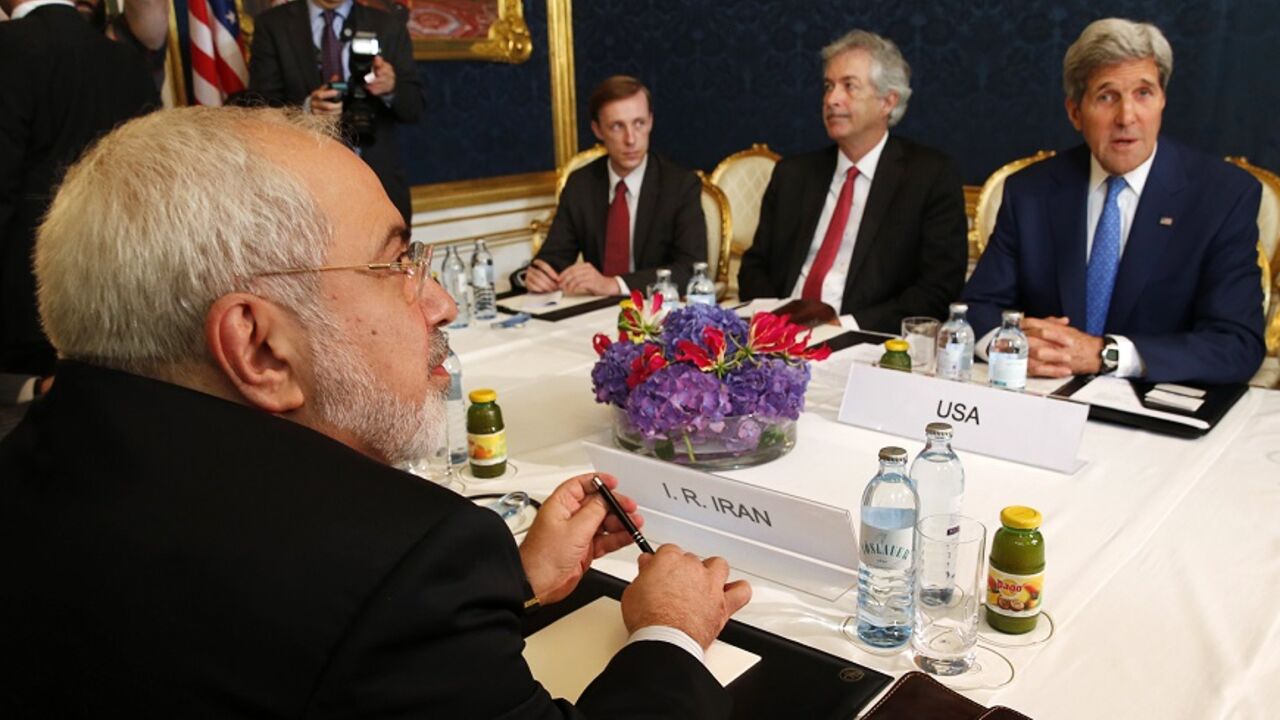 Iran's Foreign Minister Zarif holds a bilateral meeting with U.S. Secretary of State Kerry in Vienna Iran's Foreign Minister Javad Zarif (L) holds a bilateral meeting with U.S. Secretary of State John Kerry (R) on the second straight day of talks over Tehran's nuclear program in Vienna, July 14, 2014. Kerry will press his Iranian counterpart Zarif to make "critical choices" in a second straight day of talks over Tehran's nuclear program on Monday, a U.S. official said. REUTERS/Jim Bourg (AUSTRIA - Tags: POLITICS ENERGY) - RTR3YJOX