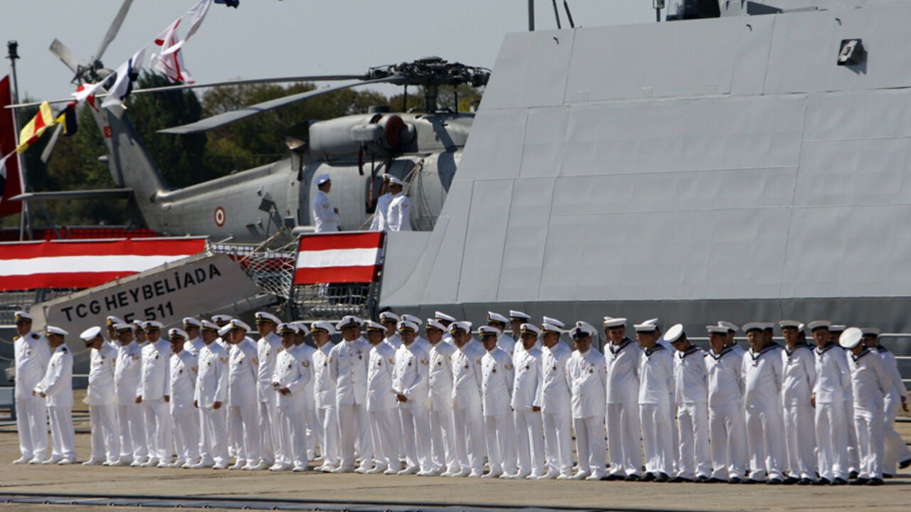 Navy officers attend a delivery ceremony for the first nationally designed combat ship TCG Heybeliada at the Tuzla Naval shipyard in Istanbul Navy officers attend a delivery ceremony for the first nationally designed combat ship TCG Heybeliada at the Tuzla Naval shipyard in Istanbul September 27, 2011. REUTERS/Osman Orsal (TURKEY - Tags: POLITICS MILITARY) - RTR2RWMP