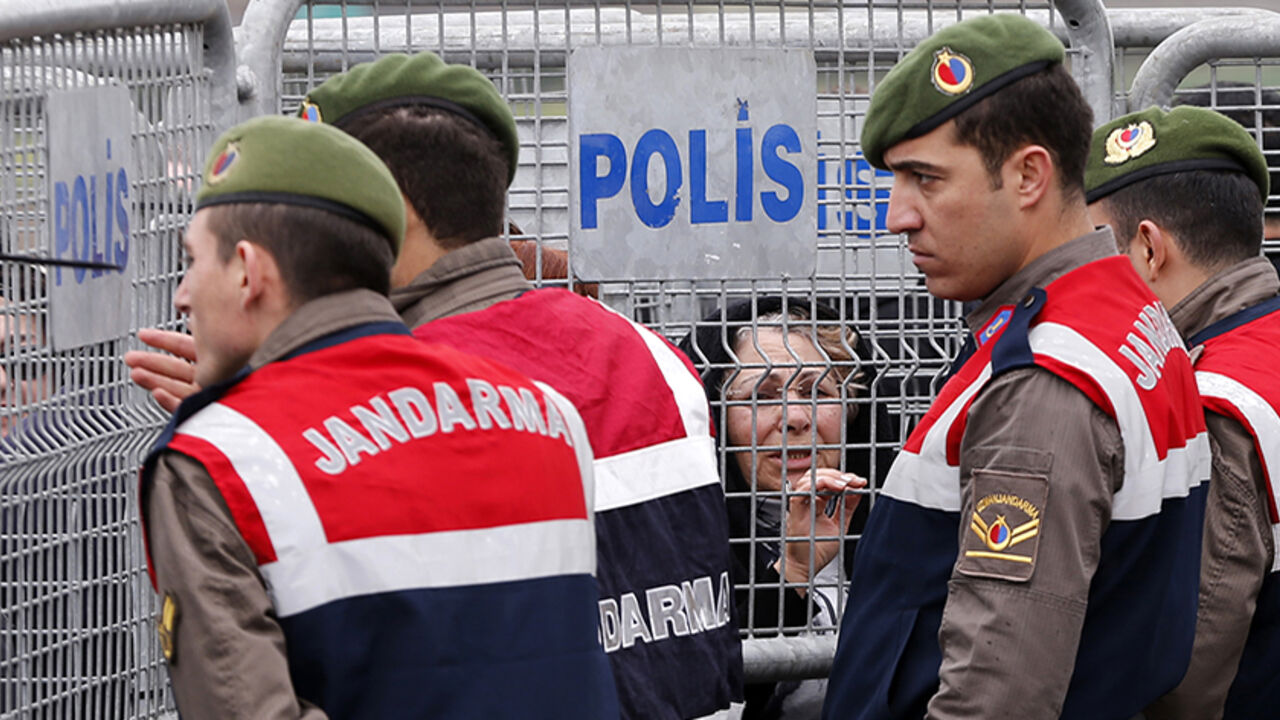 Gendarmes stand guard as visitors wait behind the security barriers outside the courthouse in Silivri near Istanbul Gendarmes stand guard as visitors wait behind the security barriers outside the courthouse in Silivri near Istanbul March 11, 2013. The trial of nearly 300 people, who are charged with attempting to overthrow Prime Minister Tayyip Erdogan's Islamist-rooted government, resumed at Silivri prison complex. The case is emblematic of Erdogan's long-standing battle with secularist opponents, and one of a series of conspiracy trials that he describes as a struggle against anti-democratic forces. REUTERS/Murad Seze