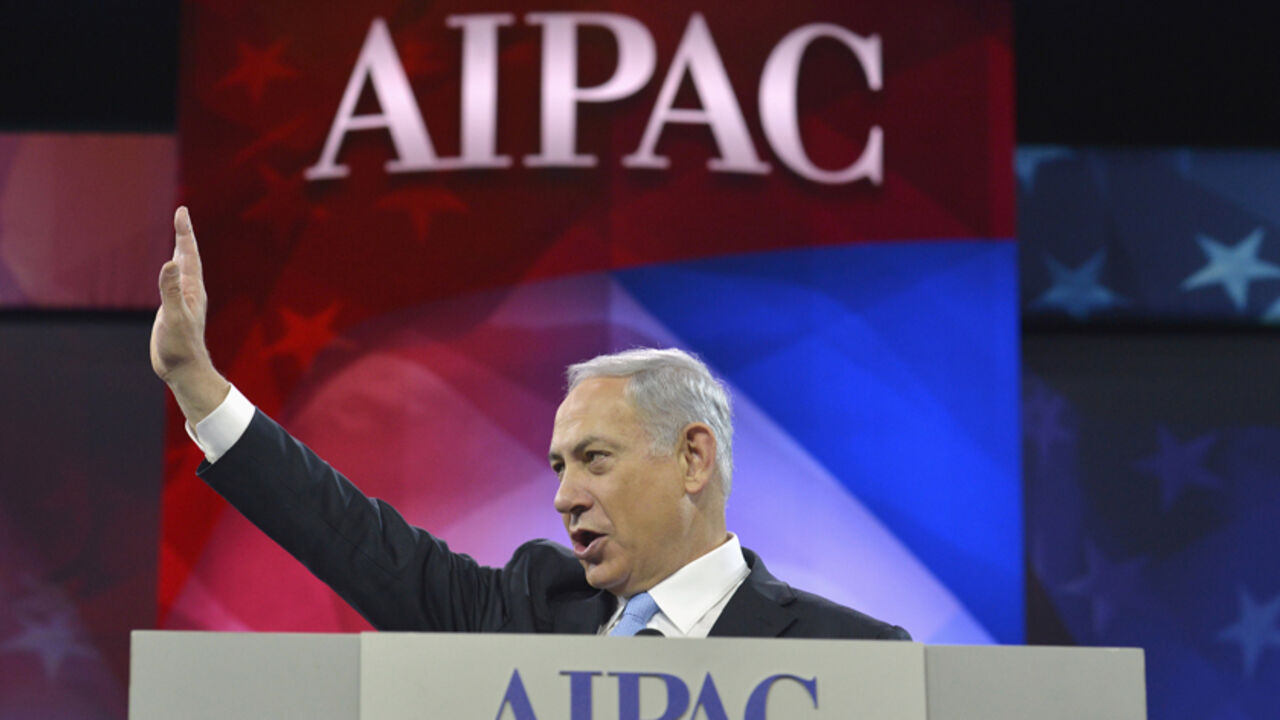 Israeli Prime Minister Benjamin Netanyahu addresses AIPAC in Washington Israeli Prime Minister Benjamin Netanyahu acknowledges applause as he arrives to address the American Israel Public Affairs Committee (AIPAC), in Washington, March 4, 2014. Netanyahu urged world powers on Tuesday not to allow Iran to retain the ability to enrich uranium, saying it must be stripped of all nuclear technologies with bomb-making potential. REUTERS/Mike Theiler (UNITED STATES - Tags: POLITICS TPX IMAGES OF THE DAY) - RTR3G15H