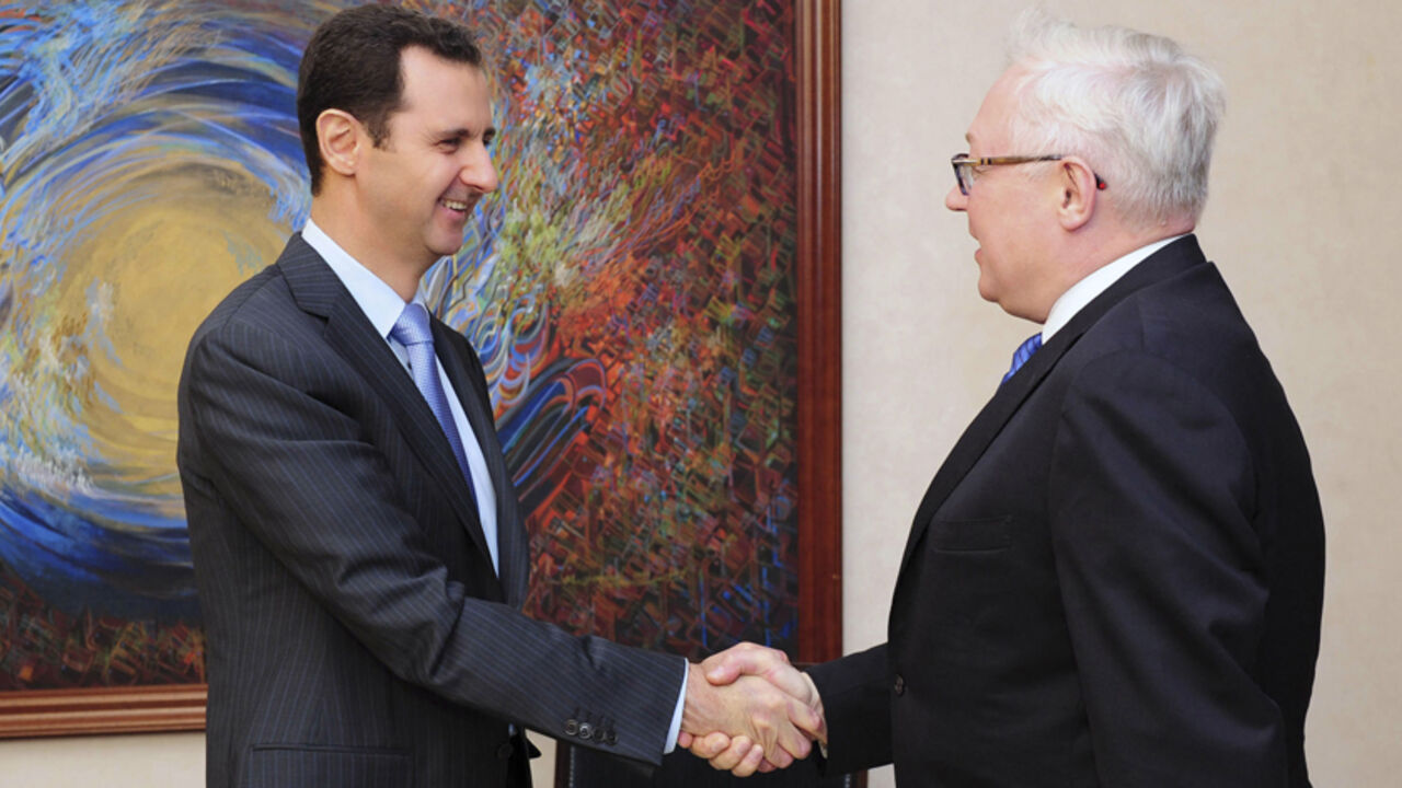 Syria's President Bashar al-Assad shakes hands with Russia's Deputy Foreign Minister Sergei Ryabkov before a meeting in Damascus Syria's President Bashar al-Assad (L) shakes hands with Russia's Deputy Foreign Minister Sergei Ryabkov before a meeting in Damascus in this June 28, 2014 picture released by Syria's national news agency SANA. REUTERS/SANA/Handout via Reuters (SYRIA - Tags: POLITICS)
ATTENTION EDITORS - THIS PICTURE WAS PROVIDED BY A THIRD PARTY. REUTERS IS UNABLE TO INDEPENDENTLY VERIFY THE AUTHENTICITY, CONTENT, LOCATION OR DATE OF THIS IMAGE. FOR EDITORIAL USE ONLY. NOT FOR SALE FOR MARKETING OR ADVERTISING CAMPAIGNS.