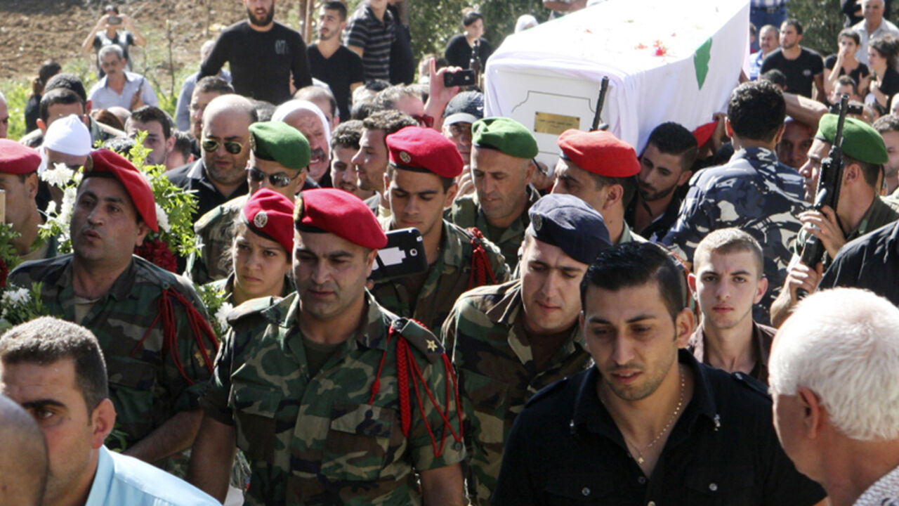 Lebanese Army soldiers and relatives of Druze soldier Khaldoon Raouf Hamoud carry his coffin during his funeral in Akbeh, Rashaya Lebanese Army soldiers and relatives of Druze soldier Khaldoon Raouf Hamoud carry his coffin during his funeral in Akbeh, Rashaya August 3, 2014. Lebanese soldiers traded fire with Islamist gunmen and shelled areas around the border town of Arsal on Sunday in a push to dislodge the biggest incursion by militants into Lebanon since Syria's civil war began. At least 10 Lebanese soldiers have died in the fighting, which erupted after Islamist gunmen seized a local police station on Saturday in response to the