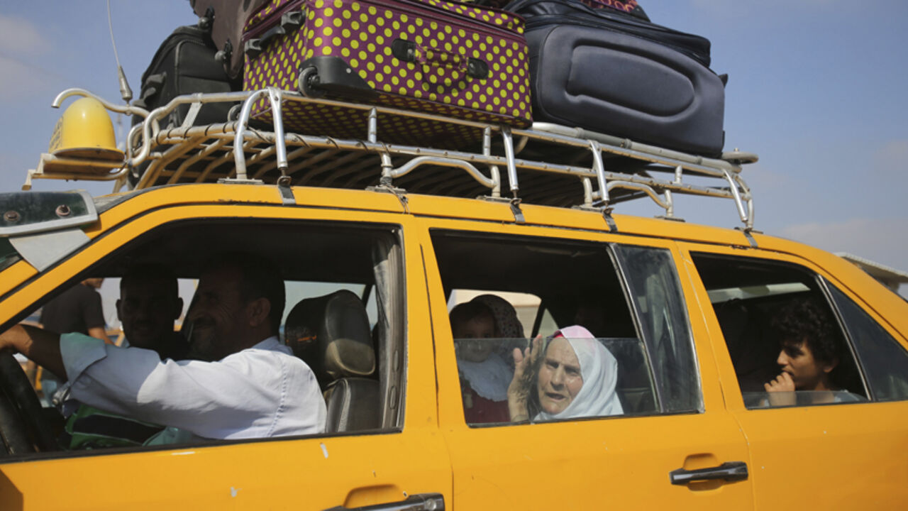 Palestinians, hoping to cross into Egypt, ride in a car as they wait at the Rafah crossing in the southern Gaza Strip Palestinians, hoping to cross into Egypt, ride in a car as they wait at the Rafah crossing in the southern Gaza Strip August 25, 2014. Under Egyptian President Abdel Fattah al-Sisi, Cairo has secured closures on the Gaza border, increasing economic pressure on Hamas from a long-running Israeli blockade. Israel's Prime Minister Benjamin Netanyahu warned Palestinian civilians on Sunday to leave immediately any site where militants are operating, one day after Israel flattened a 13-storey apartment block in Ga