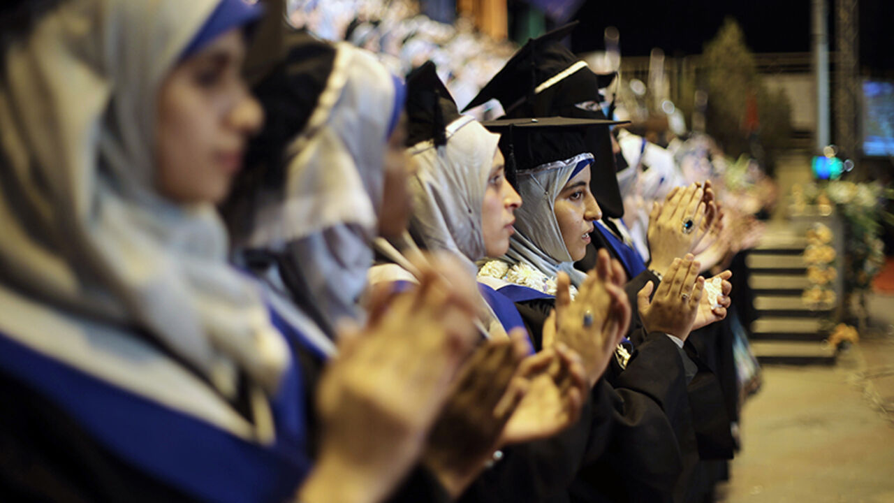 Palestinian students attend their graduation ceremony at the University College of Applied Sciences in Gaza City Palestinian students attend their graduation ceremony at the University College of Applied Sciences in Gaza City September 10, 2014. REUTERS/Ibraheem Abu Mustafa (GAZA - Tags: EDUCATION) - RTR45QL9