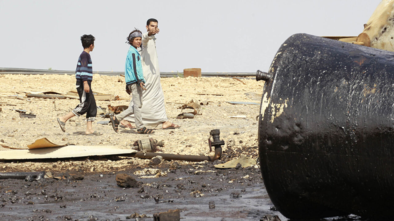 People inspect damage at an oil refinery that was targeted by what activists said were U.S.-led air strikes at al-Khaboura village, near the Syrian town of Tel Abyad of Raqqa governate People inspect damage at an oil refinery that was targeted by what activists said were U.S.-led air strikes at al-Khaboura village, near the Syrian town of Tel Abyad of Raqqa governate October 2, 2014. Air strikes believed to have been carried out by U.S.-led forces hit three makeshift oil refineries in Syria's Raqqa province early on Sunday as part of an assault to weaken Islamic State (IS) militants, a human rights group said. The United States has been carrying out strikes in Iraq against the Islamic Sta