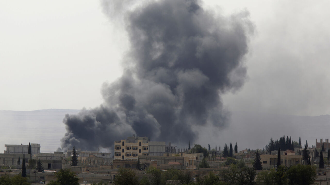 Smoke rises from the Syrian town of Kobani, seen from near the Mursitpinar border crossing on the Turkish-Syrian border in the southeastern town of Suruc Smoke rises from the Syrian town of Kobani, seen from near the Mursitpinar border crossing on the Turkish-Syrian border in the southeastern town of Suruc, Sanliurfa province, October 3, 2014. Turkey will do what it can to prevent the predominantly Kurdish town of Kobani, near its border with Syria, falling to Islamic State insurgents, Prime Minister Ahmet Davutoglu said late on Thursday, but stopped short of committing to military action. Hours before Davutoglu's comments, parliament gave the government pow