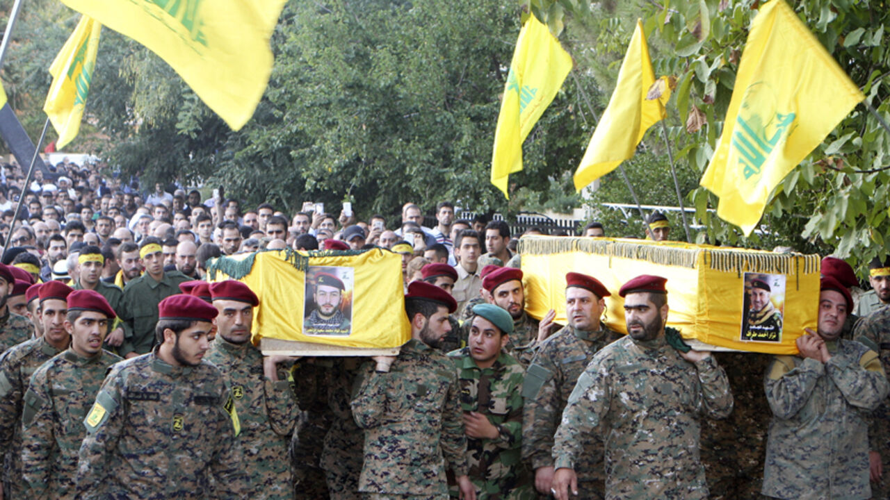 Lebanon's Hezbollah members carry the coffins of two of their comrades, who were killed in clashes with fighters from the Nusra Front in eastern Lebanon, during their funeral in Baalbek, in the Bekaa valley Lebanon's Hezbollah members carry the coffins of two of their comrades, who were killed in clashes with fighters from the Nusra Front in eastern Lebanon, during their funeral in Baalbek, in the Bekaa valley October 6, 2014. Ten fighters from Lebanon's Shi'ite Hezbollah group were killed in clashes with fighters from al-Qaeda's Syrian wing in eastern Lebanon on Sunday, a source close to the group said on Monday. The Qaeda fighters, who see Hezbollah as among their chief foes, attacked a large area stretching