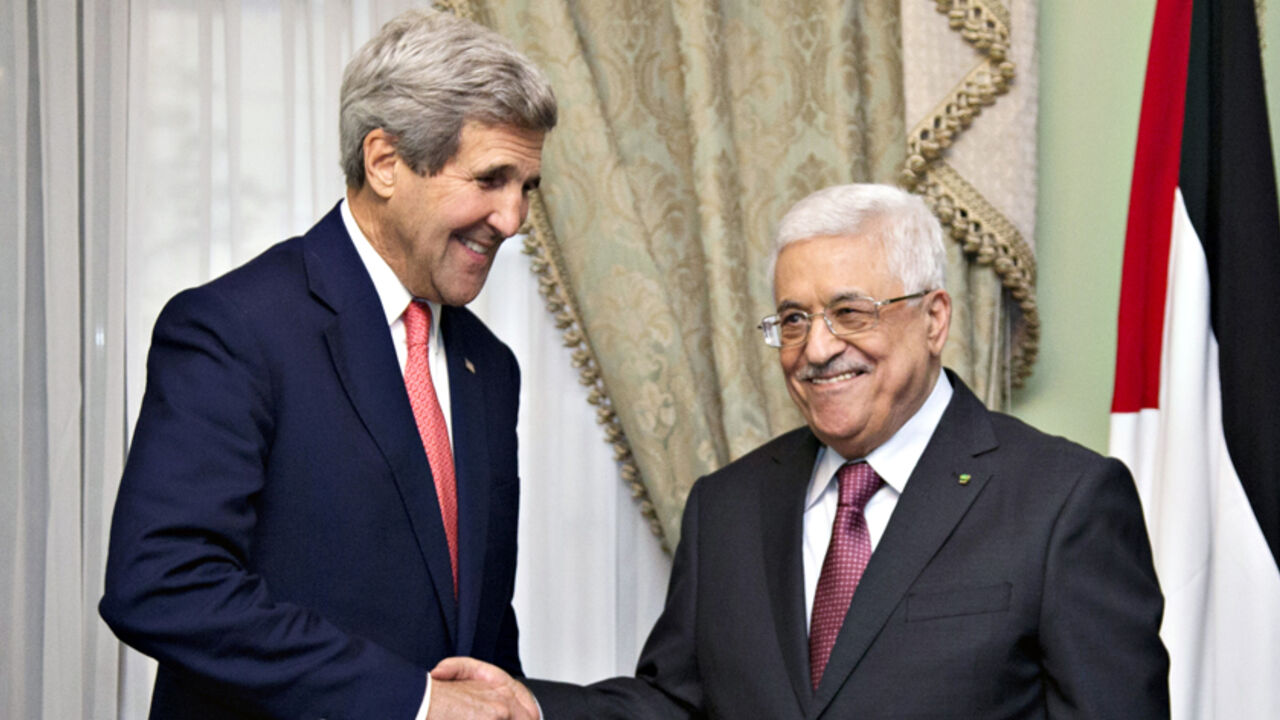 U.S. Secretary of State John Kerry shakes hands with Palestinian President Mahmoud Abbas in Cairo U.S. Secretary of State John Kerry shakes hands with Palestinian President Mahmoud Abbas (R) at Andalus Villa in Cairo October 12, 2014, on the sidelines of the Gaza Donor Conference. REUTERS/Carolyn Kaster/Pool (EGYPT - Tags: POLITICS) - RTR49VLY